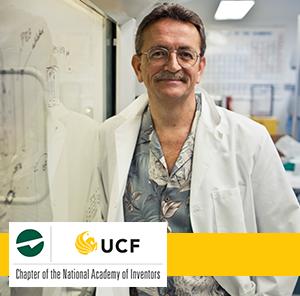 UCF inventor Dr. Hickman leaning on white board